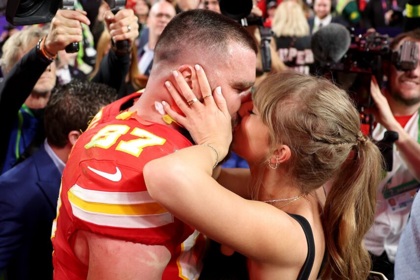 Travis Kelce #87 of the Kansas City Chiefs kisses Taylor Swift after defeating the San Francisco 49ers 25-22 in overtime during Super Bowl LVIII at Allegiant Stadium on February 11, 2024 in Las Vegas, Nevada.