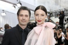 Tony McGill and Caitriona Balfe attends the 92nd Annual Academy Awards at Hollywood and Highland on February 09, 2020 in Hollywood, California.