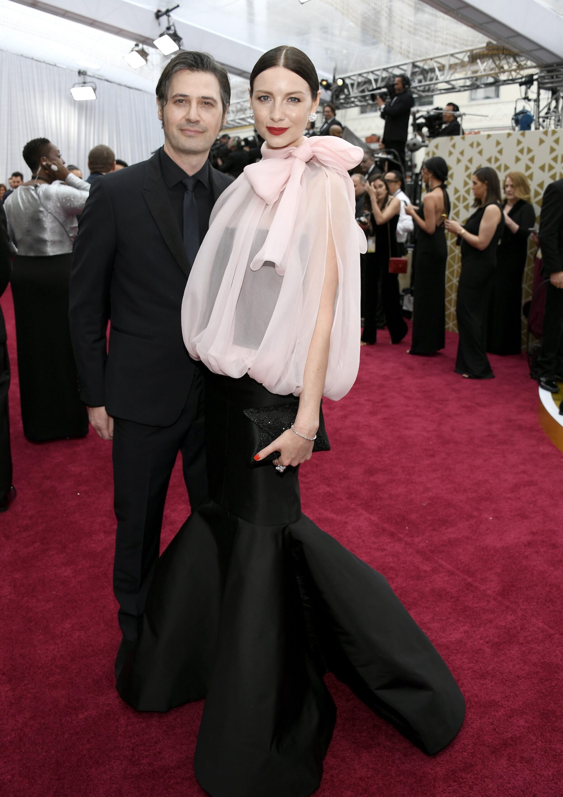 Tony McGill and Caitriona Balfe attends the 92nd Annual Academy Awards at Hollywood and Highland on February 09, 2020 in Hollywood, California.