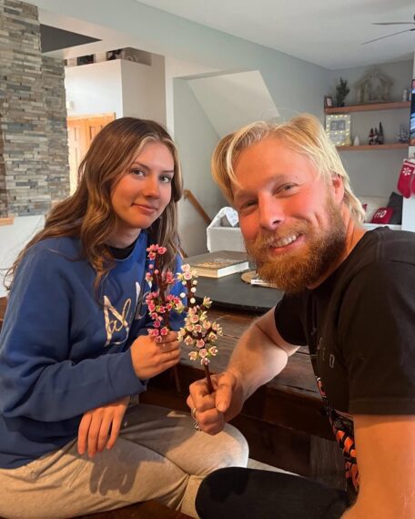 Ethan Plath's new girlfriend and Ethan Plath holding flowers.