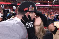 Taylor Swift kisses Travis Kelce #87 of the Kansas City Chiefs after defeating the Buffalo Bills 32-29 in the AFC Championship Game at GEHA Field at Arrowhead Stadium on January 26, 2025 in Kansas City, Missouri.