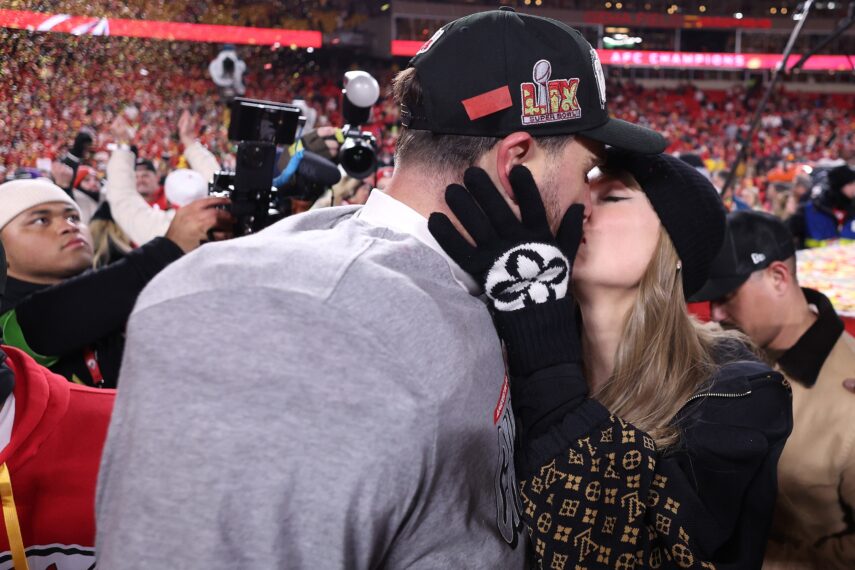 Taylor Swift kisses Travis Kelce #87 of the Kansas City Chiefs after defeating the Buffalo Bills 32-29 in the AFC Championship Game at GEHA Field at Arrowhead Stadium on January 26, 2025 in Kansas City, Missouri.