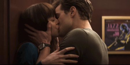 Dakota Johnson and Jamie Dornan kissing in an elevator in Fifty Shades of Grey