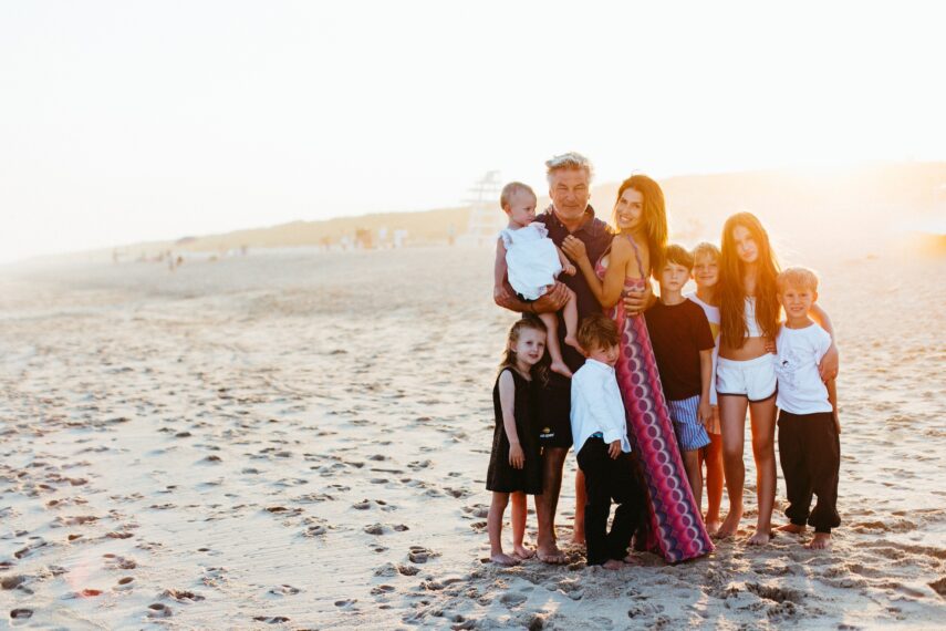 alec and hilaria baldwin with their kids on the beach