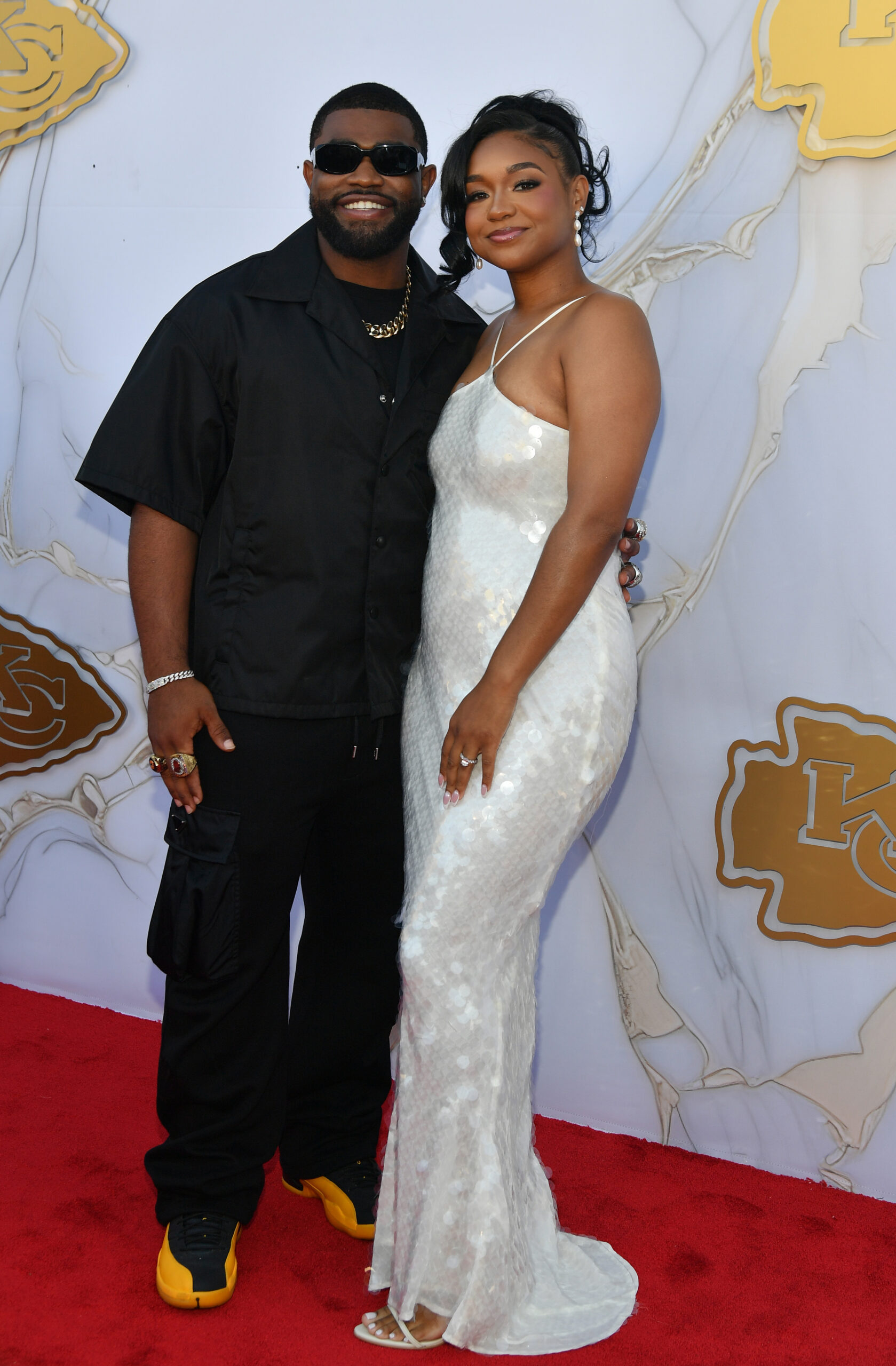 Clyde Edwards-Helaire of the Kansas City Chiefs and his girlfriend Jo Jo O'Connor arrive on the red carpet prior to the Kansas City Chiefs Super Bowl Ceremony