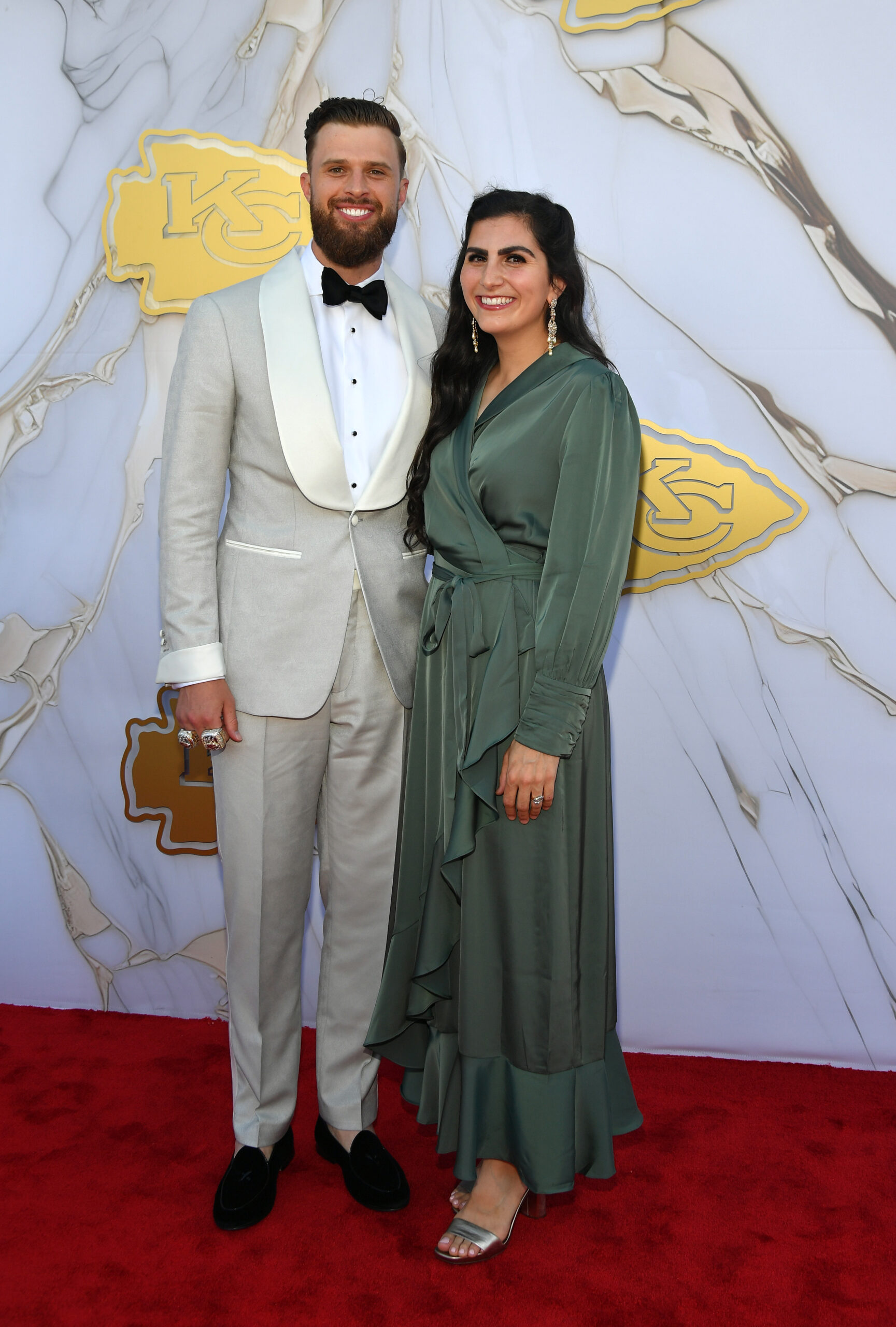 Harrison Butker of the Kansas City Chiefs and his wife Isabelle Butker arrive on the red carpet prior to the Kansas City Chiefs Super Bowl Ceremony