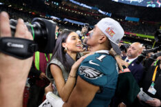 Jalen Hurts #1 of the Philadelphia Eagles and fiancee, Bry Burrows, embrace after defeating the Kansas City Chiefs 40-22 to win Super Bowl LIX