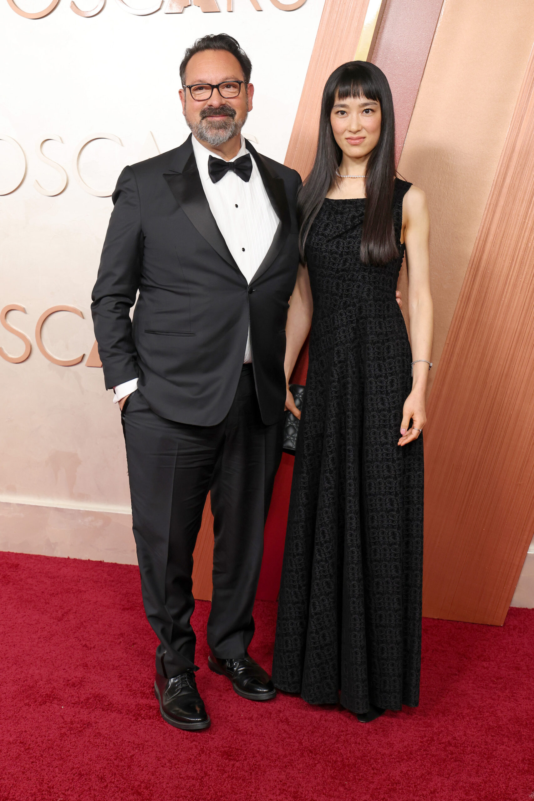 HOLLYWOOD, CALIFORNIA - MARCH 02: (L-R) James Mangold and Eriko Hatsune attend the 97th Annual Oscars at Dolby Theatre on March 02, 2025 in Hollywood, California.