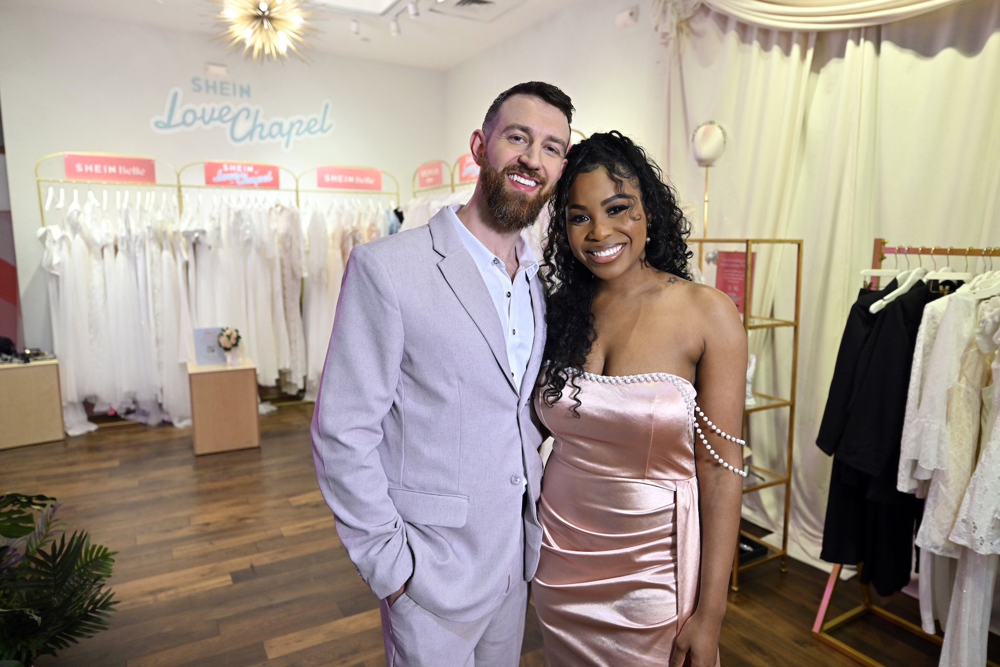 Cameron Hamilton (L) and Lauren Speed-Hamilton attend the SHEIN Love Chapel Vegas wedding pop-up and retail shop at the Fashion Show Las Vegas on May 25, 2024 in Las Vegas, Nevada.