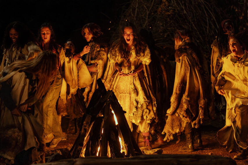 L-R: Silvana Estifanos as Teen Britt, Anisa Harris as Teen Robin, Vanessa Prasad as Teen Gen, Liv Hewson as Teen Van, Kevin Alves as Teen Travis, Courtney Eaton as Teen Lottie, Sophie Thatcher as Teen Natalie, Nia Sondaya as Teen Akilah and Sophie Nélisse as Teen Shauna in 'Yellowjackets' Season 3 Episode 6 - 'Thanksgiving (Canada)'