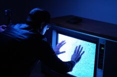 Zak Bagans touching TV in Poltergeist house