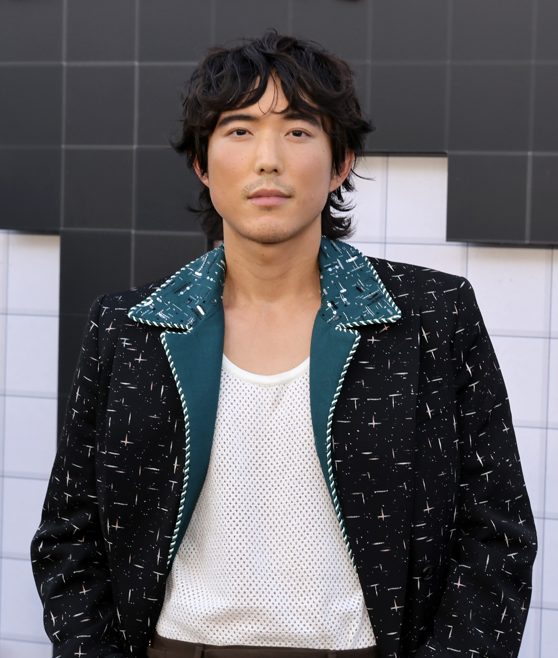 Justin H. Min attends the premiere of the final season of 