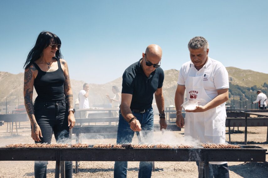 Stanley Tucci stops at an iconic BBQ joint called Ristoro Mucciante and meets food and motor journalist Cristina Bachetti, left and cooks with one of the owners, Rodolfo Mucciante
