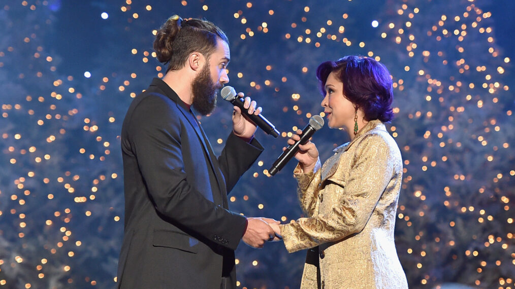 Singers Ace Young (L) and Diana DeGarmo perform onstage during the 2015 Hollywood Christmas Parade