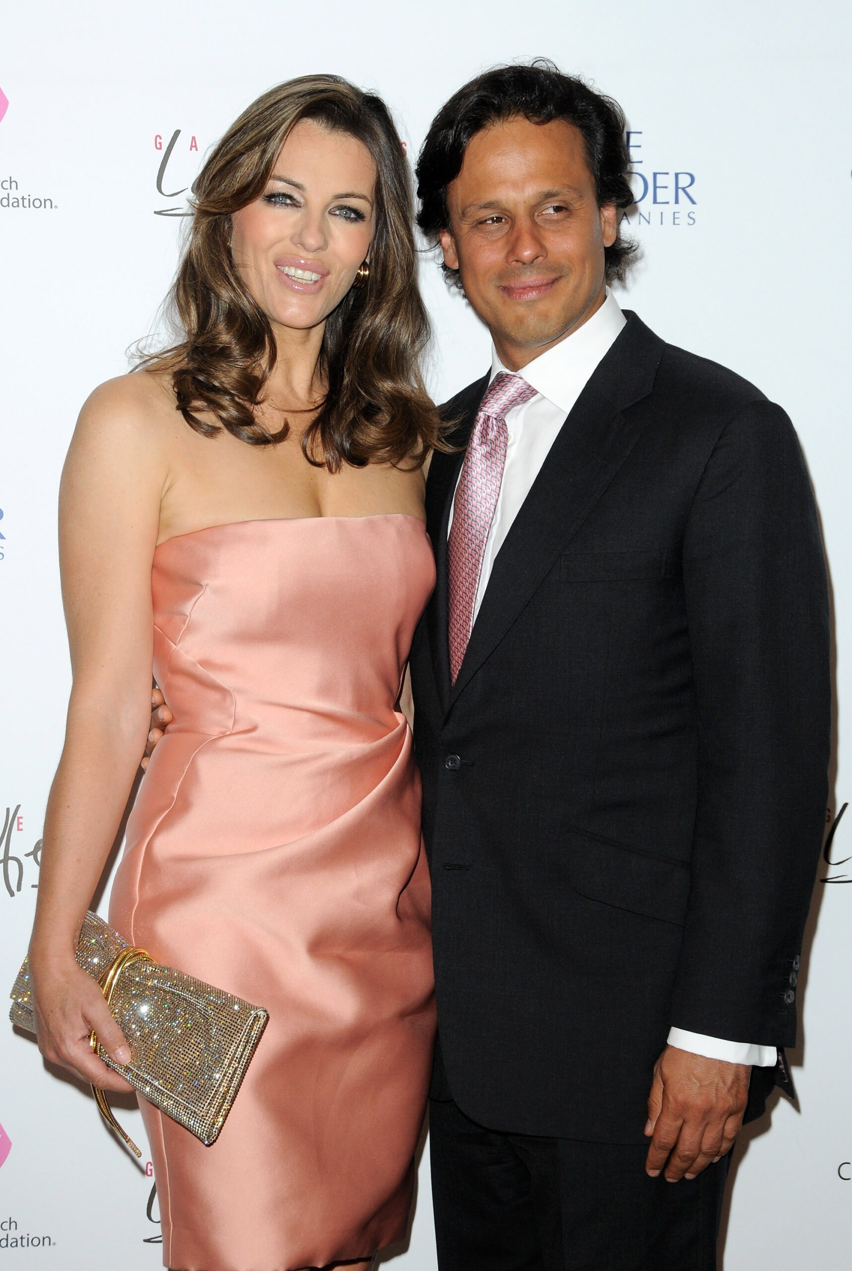 Elizabeth Hurley (L) and Arun Nayar (R) attend the Evelyn H. Lauder photo exhibition