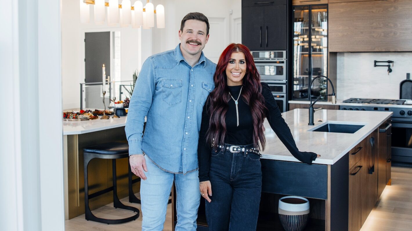 Hosts Chelsea and Cole do finishing touches in renovated kitchen at homeowner Tupys, as seen on Down Home Fab, Season 3.