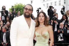 Jason Momoa and Adria Arjona attend the 'Highest 2 Lowest' red carpet at the 78th annual Cannes Film Festival at Palais des Festivals on May 19, 2025 in Cannes, France.