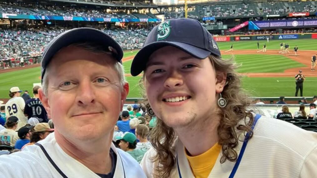 Ken Jennings (left) with his son, Dylan (right) at a Seattle Mariners baseball game