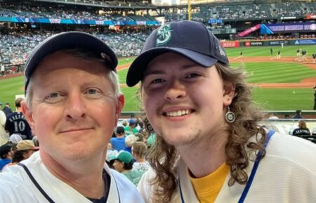 Ken Jennings (left) with his son, Dylan (right) at a Seattle Mariners baseball game