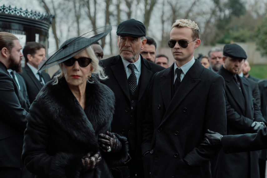 Helen Mirren as Maeve Harrigan, Pierce Brosnan as Conrad Harrigan, and Anson Boon as Eddie Harrigan in 'MobLand' Season 1 Episode 5, 'Funeral for a Friend'