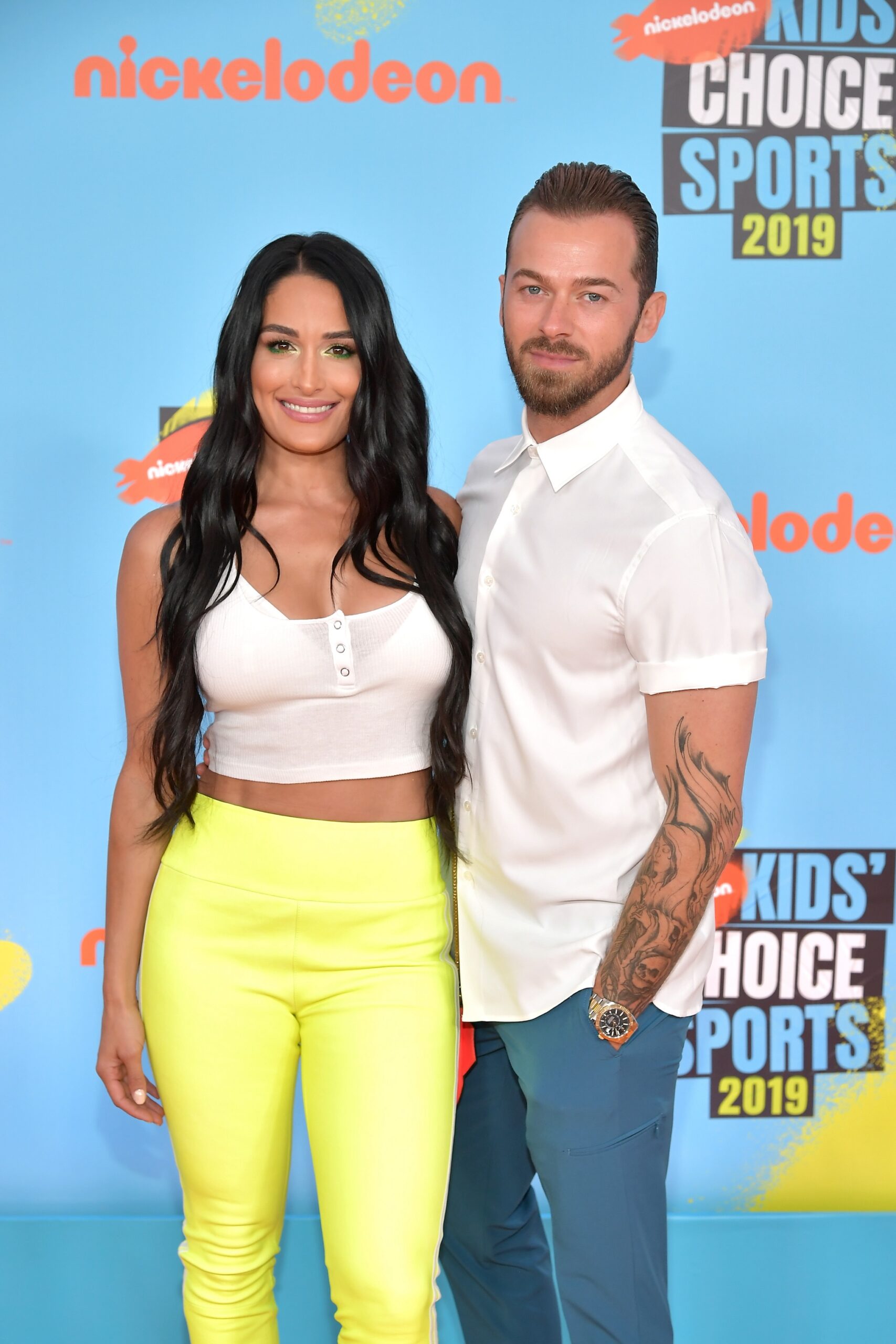 Nikki Bella and Artem Chigvintsev attend Nickelodeon Kids' Choice Sports 2019 at Barker Hangar on July 11, 2019 in Santa Monica, California.