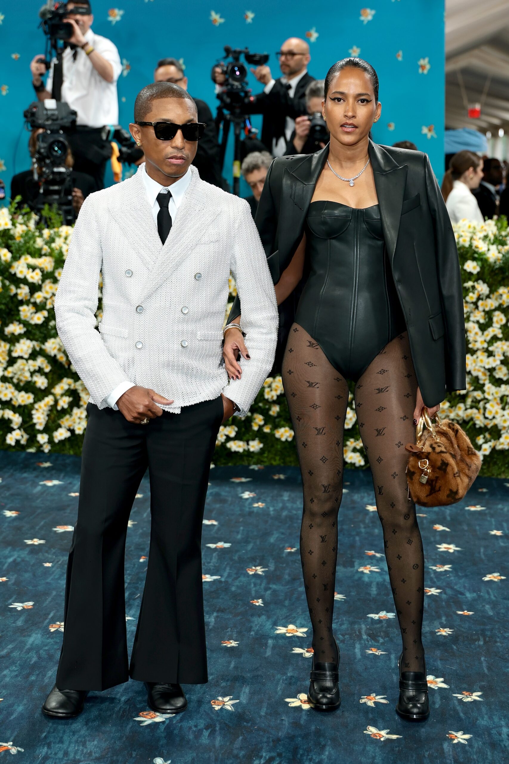Pharrell Williams and Helen Lasichanh attend the 2025 Met Gala Celebrating 