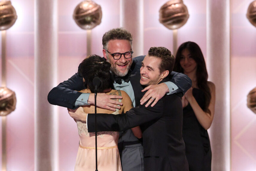 Zoë Kravitz and Dave Franco present the Best Performance by a Lead Actor in a TV Series – Musical or Comedy Award for "The Studio" to Seth Rogen (C) onstage during the 83RD ANNUAL GOLDEN GLOBES