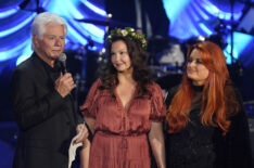Larry Strickland, Ashley Judd, and Wynonna Judd speak onstage for Naomi Judd: 'A River Of Time' Celebration at Ryman Auditorium on May 15, 2022
