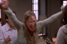 Liza Weil throws her arms up in excitement