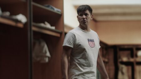Thorpe Recreation__Jim Thorpe standing in locker room at the Olympics._