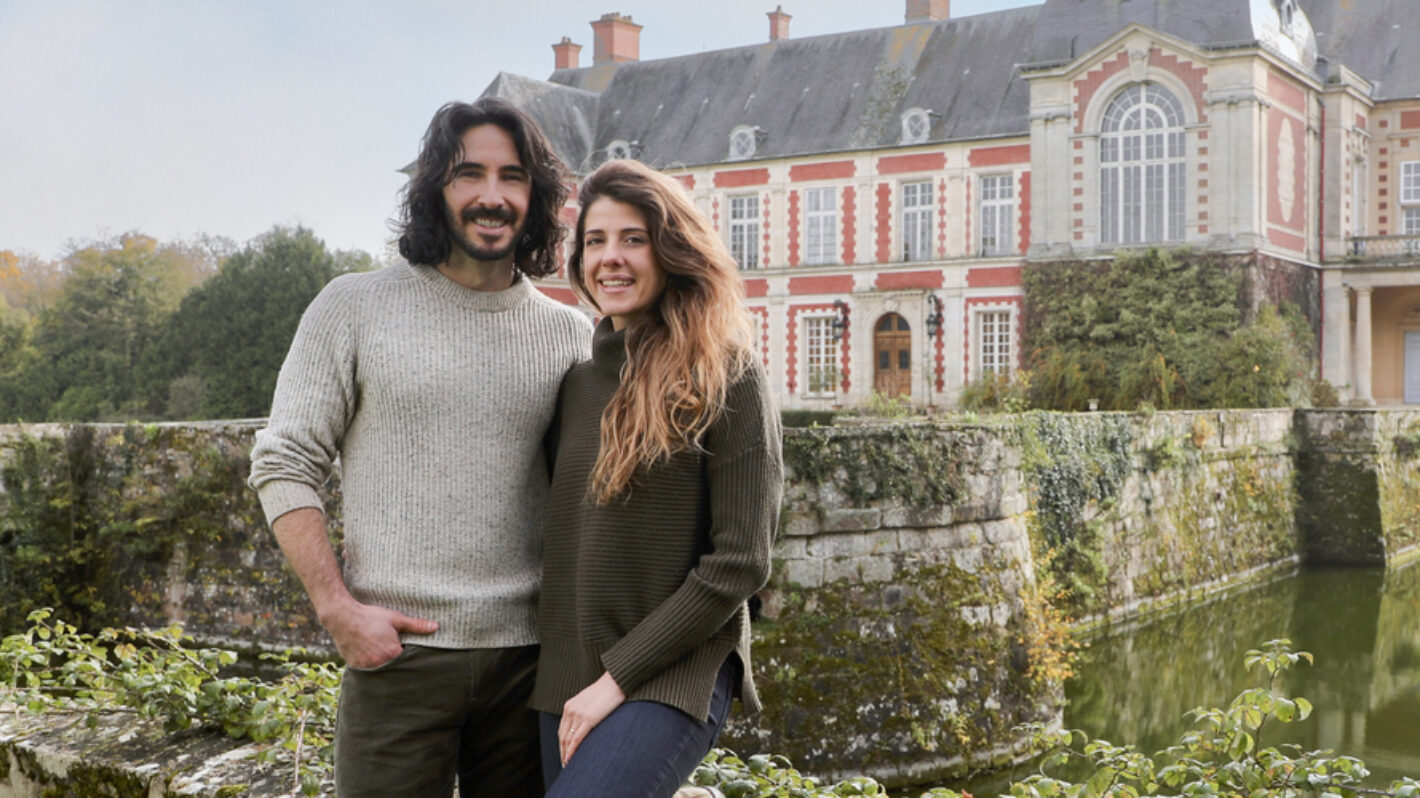 Ian Figueira and Daphne Reckert stood outside the Chateau, as seen on Castle Impossible, Season 1.