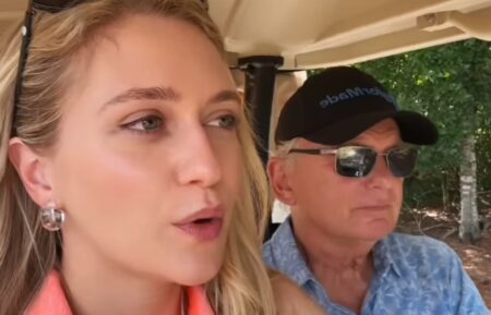 Maggie and Pat Sajak riding in a golf cart