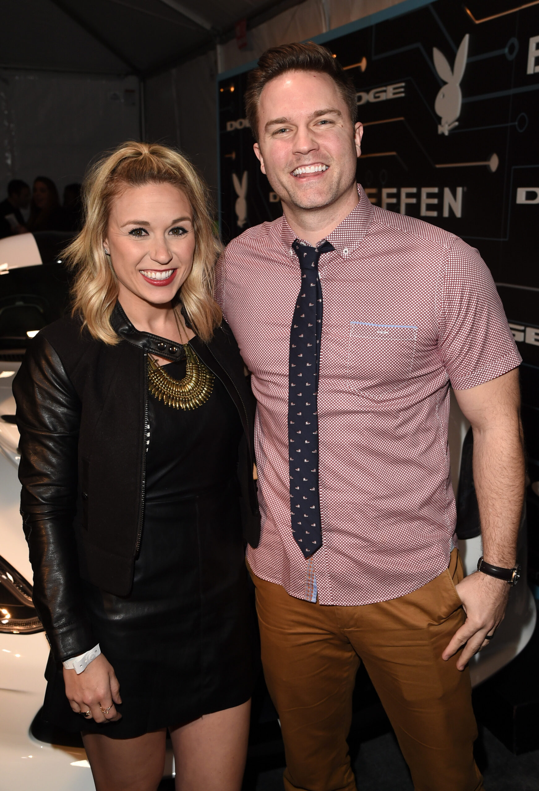 Kelsey Mayfield and actor Scott Porter (R) arrive at The Playboy Party during Super Bowl Weekend