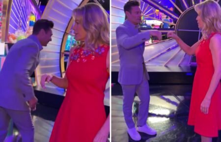 Ryan Seacrest and Vanna White doing their pre wheel of fortune handshake