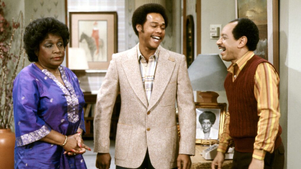 image from an early season of 'The Jeffersons,' probably 1975. Left to right are stars Isabel Sanford as 'Weezy,' Mike Evans as Lionel and Sherman Hemsley as George. Lionel and George are laughing about something, but Weezy does not look amused.
