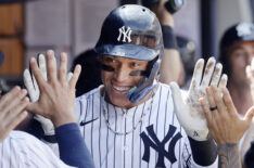 Aaron Judge #99 of the New York Yankees celebrates in the dugout after his ninth inning two run home run against the Chicago Cubs at Yankee Stadium on July 12, 2025 in New York City.