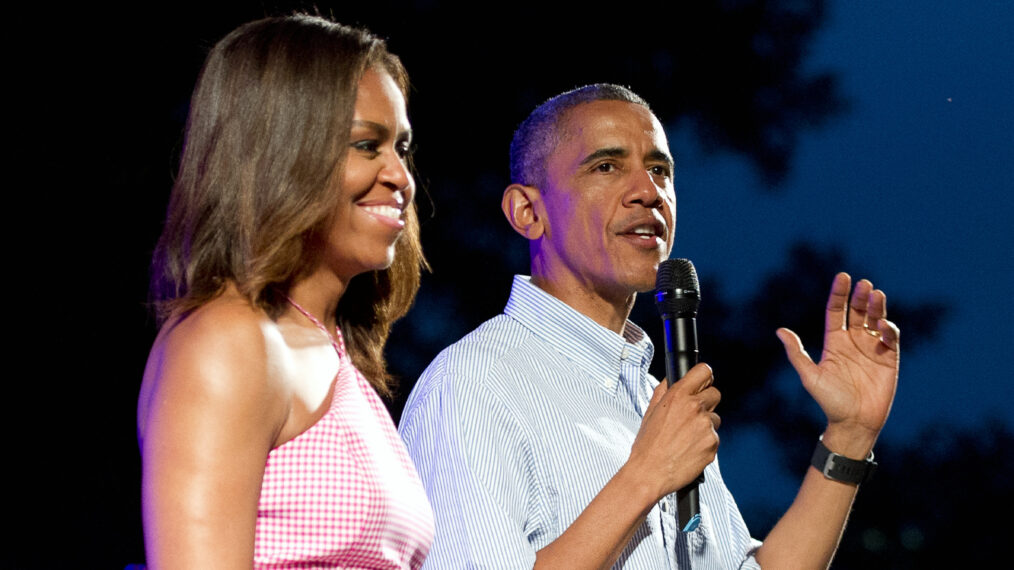 U.S. President Barack Obama (R), accompanied by first lady Michelle Obama, gives remarks to members of the military and White House staff
