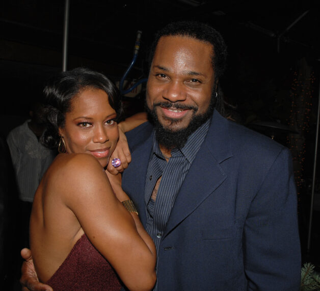 Actors Regina King (L) and Malcolm-Jamal Warner attend the after party following the premiere of Screen Gems "This Christmas"