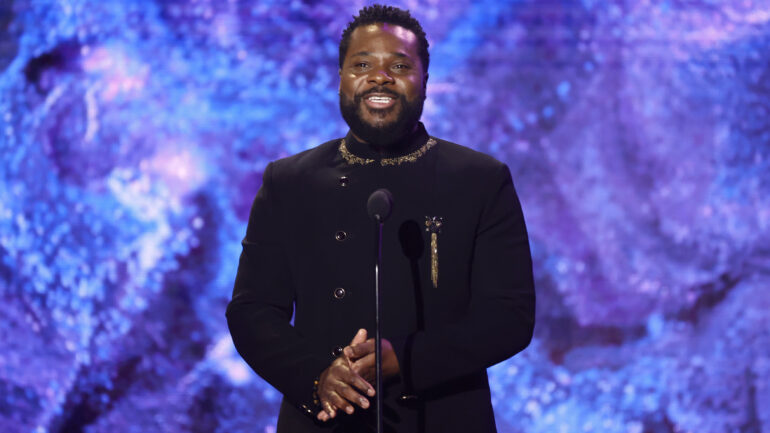 Malcolm-Jamal Warner speaks onstage during the 65th GRAMMY Awards