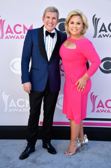 TV personalities Todd Chrisley (L) and Julie Chrisley attend the 52nd Academy Of Country Music Awards at Toshiba Plaza on April 2, 2017 in Las Vegas, Nevada
