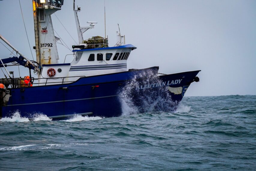 Aleutian Lady at sea with full stack, waves plashes the bow