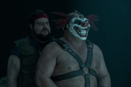 TWISTED METAL -- "NUY3ARZ" Episode 212 -- Pictured: (l-r) Mike Mitchell as Stu, Joe Seanoa as Sweet Tooth -- (Photo by: Pief Weyman/PEACOCK)