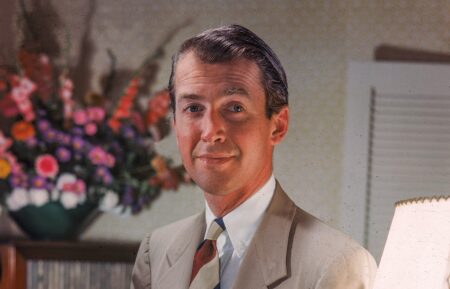 Jimmy Stewart (1908 -1997) seated wearing a tan suit, 1940s.