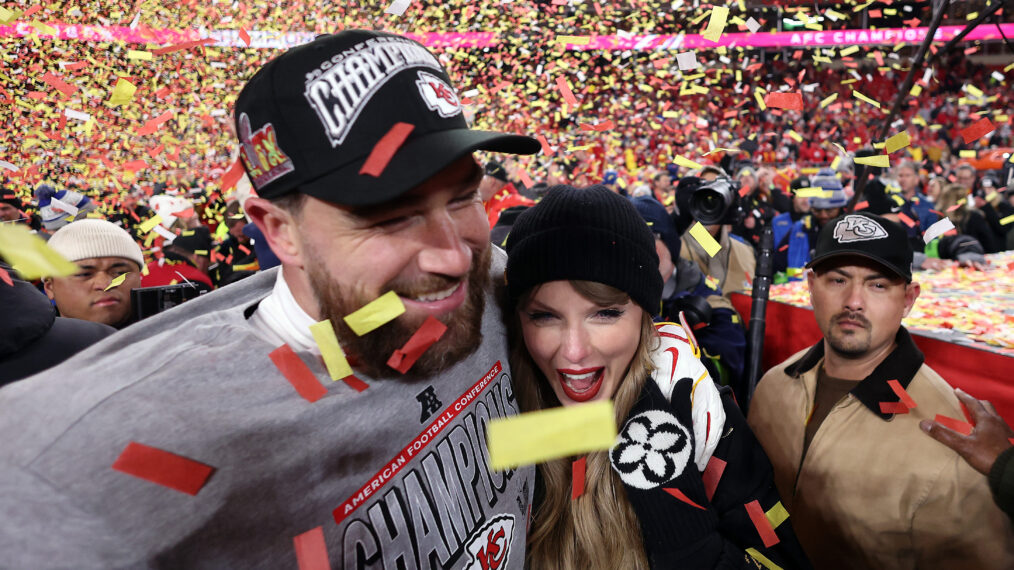 Travis Kelce #87 of the Kansas City Chiefs celebrates with Taylor Swift after the Chiefs defeated the Buffalo Bills 32-29 to win the AFC Championship Game