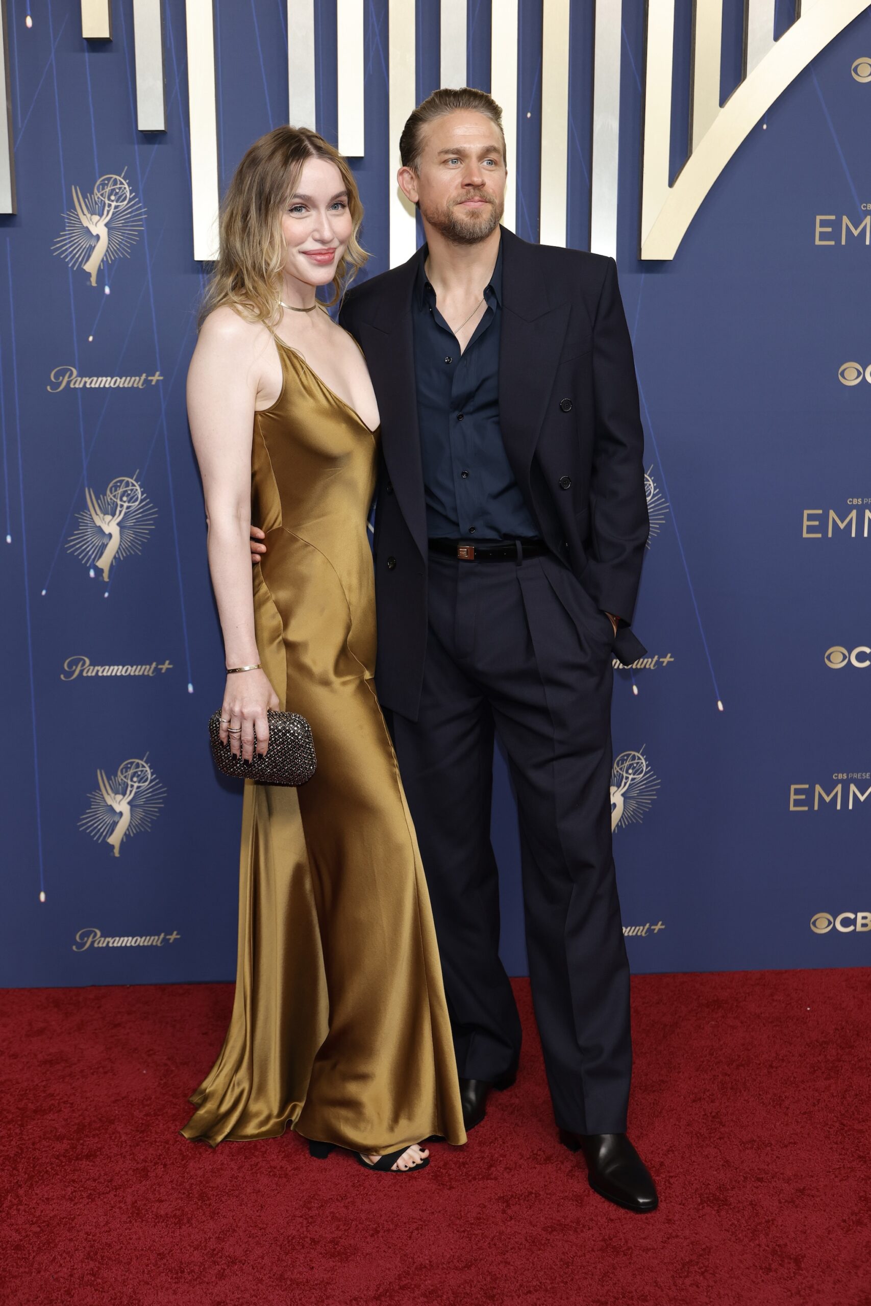 Morgana McNelis and Charlie Hunnam attend the 77th Primetime Emmy Awards at Peacock Theater on September 14, 2025 in Los Angeles, California.