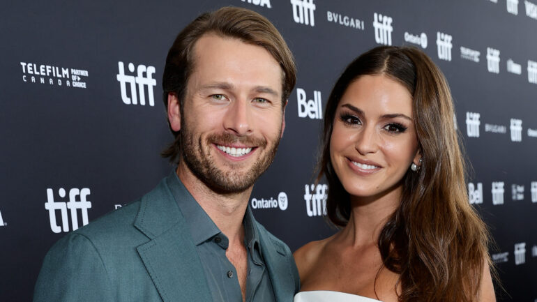Glen Powell and Gigi Paris attend the "Devotion" Premiere at Cinesphere on September 12, 2022 in Toronto, Ontario.