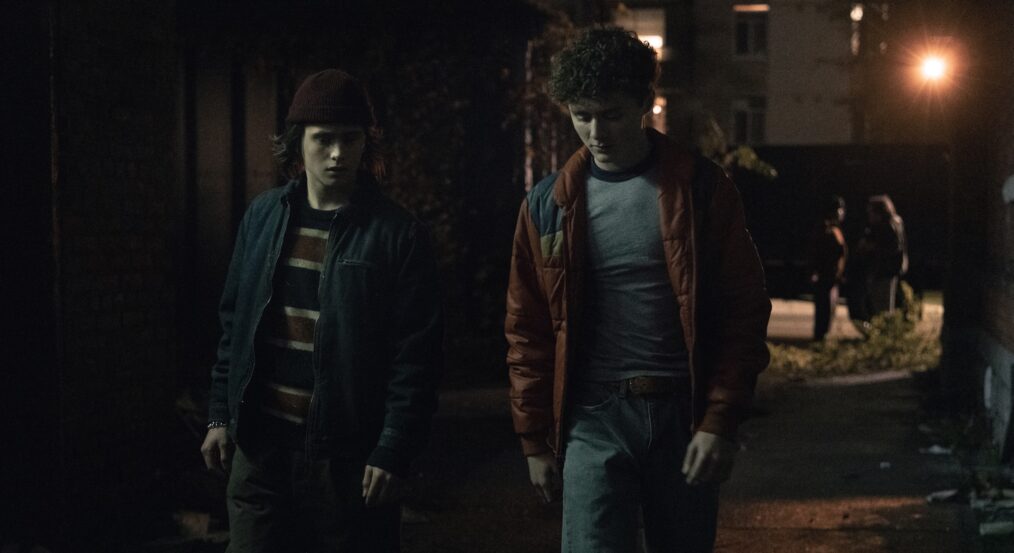 DEVIL IN DISGUISE: JOHN WAYNE GACY -- Episode 103 -- Pictured: (l-r) Etienne Kellici as Sam Stapleton, Finaly Wojtak-Hissong as Randall Reffett— (Photo by: Brooke Palmer/PEACOCK)