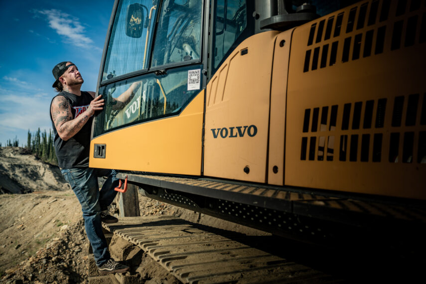 Rick Ness climbing into Volvo excavator cab, "Gold Rush" Season 16