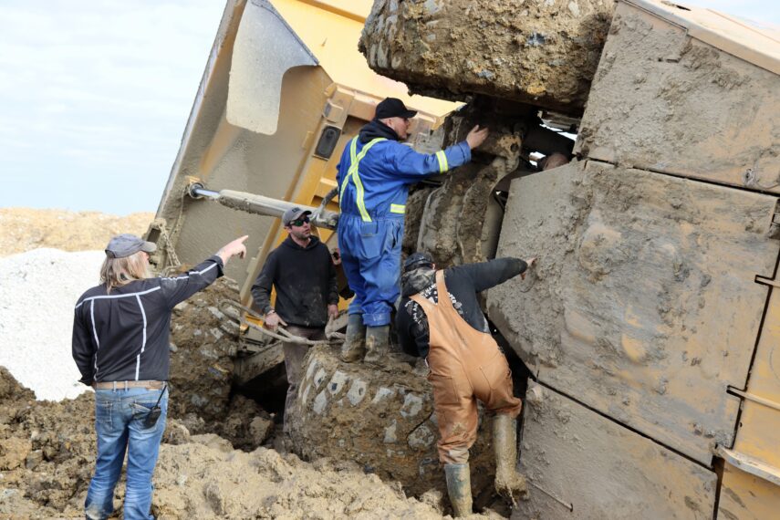 Tony Beets instructing crew attaching chains to underside of overturned cab, "Gold Rush" Season 16
