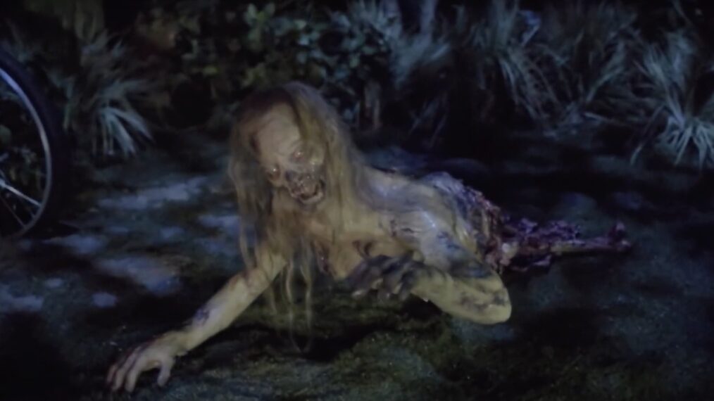 A zombie from 'The Walking Dead' crawls toward guests
